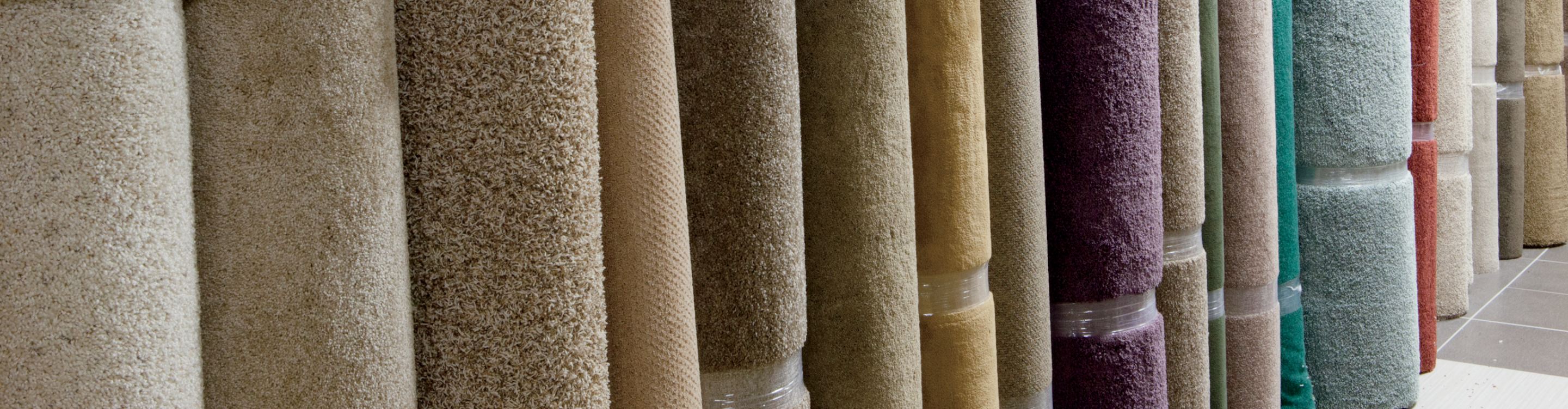 Colorful rolls of carpet remnants display